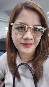 Woman with glasses smiling