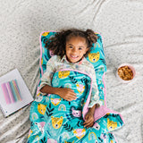 Girl laying on floor in Party Animals Plush Nap Mat with snack and a a notebook and pens beside her