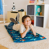 boy laying on vinyl rest mat with Transportation rest mat cover