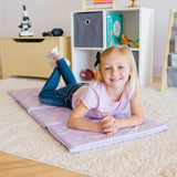 Girl laying on Unicorn vinyl rest mat