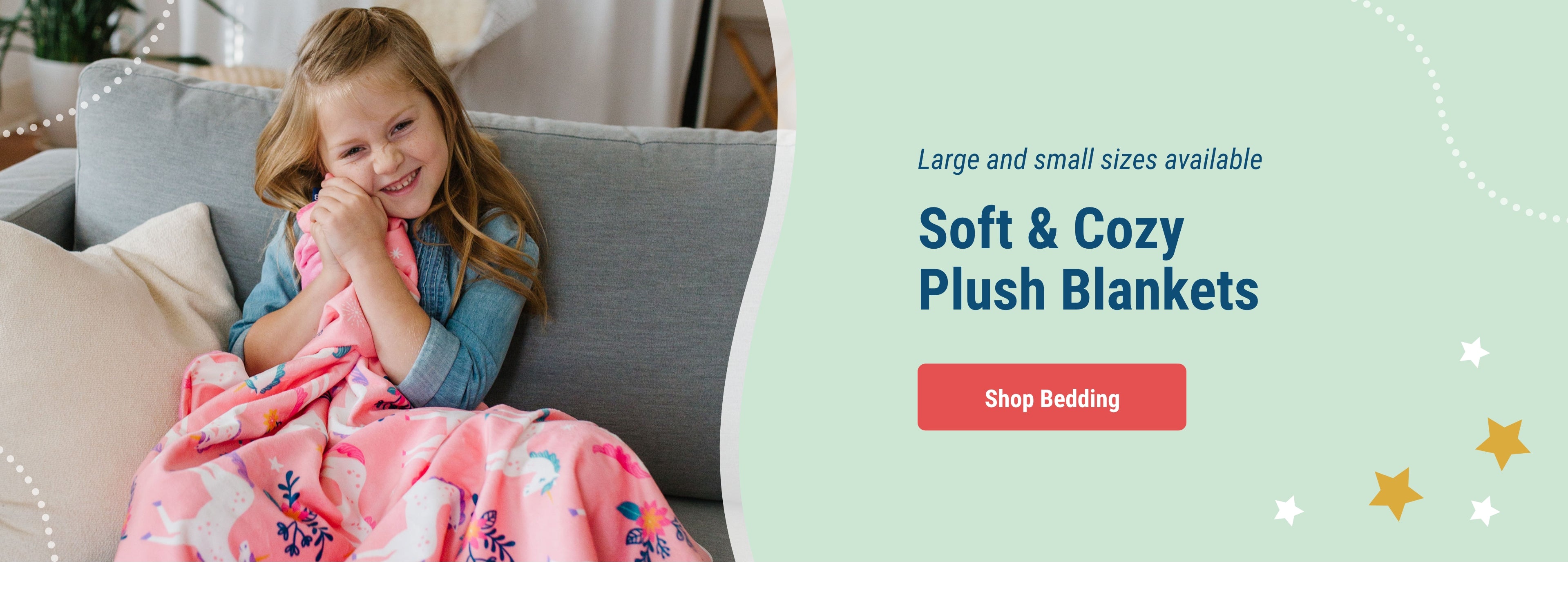 Large and small sizes available. Soft & Cozy Plush Blankets. Link to Shop Bedding. Image of girl holding Plush blanket with Magical Unicorns pattern