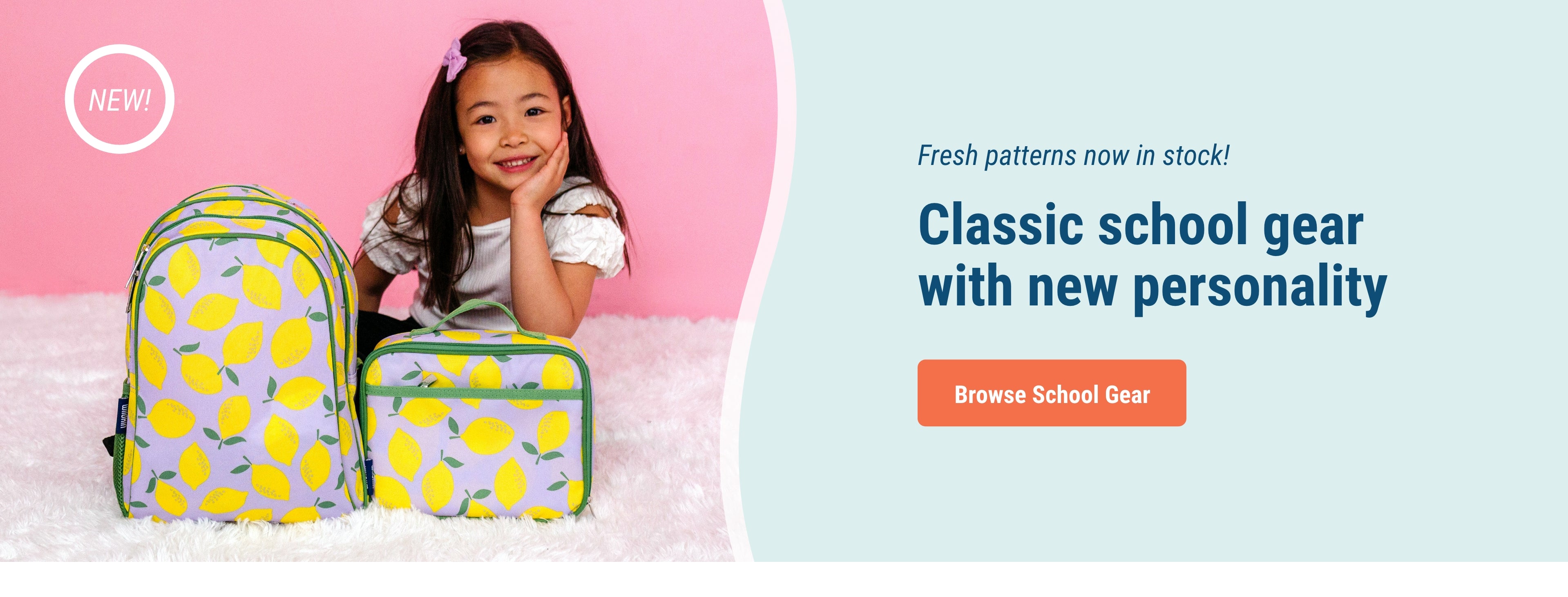 Fresh patterns now in stock! Classic school gear with new personality. Link to Browse school gear. Image of girl sitting on floor with lilac lemonade Lunch box and backpack